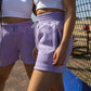 UC BADGE SHORT 2.0| LILAC